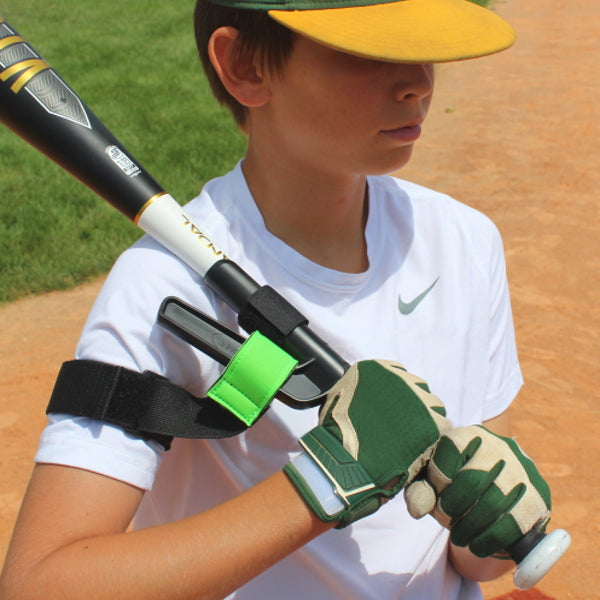 youth baseball player showing with swingrail swing trainer